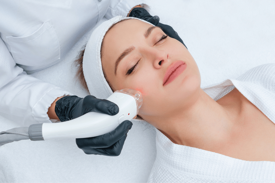 Woman receiving a facial skin treatment at a medical spa