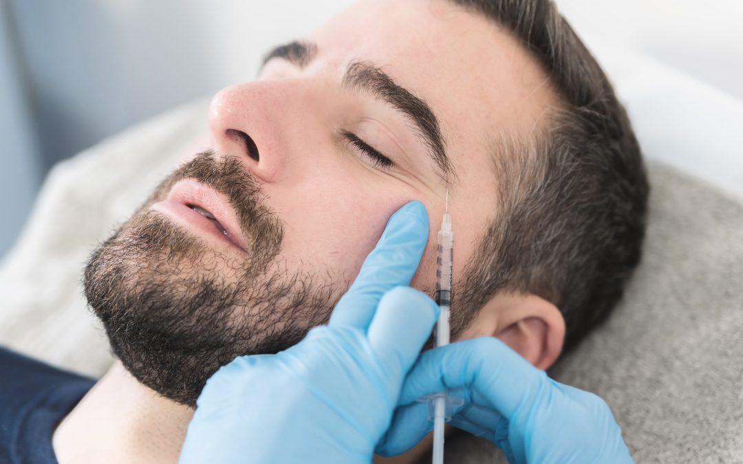 Man receiving Botox injections from a medical aesthetics provider